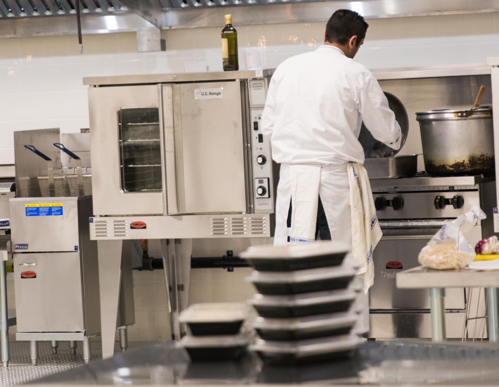 A chef working the line in a licensed commercial kitchen